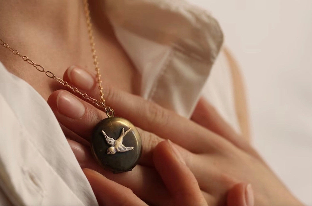 ANTIQUE BIRD LOCKET