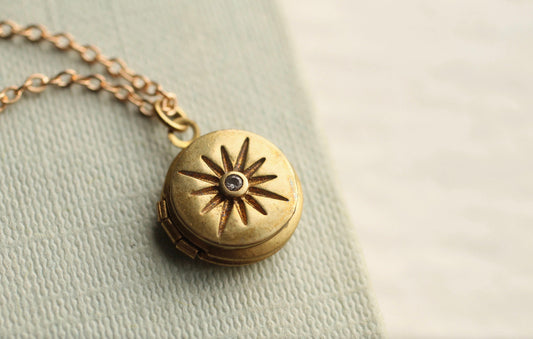 TINY COMPASS STAR LOCKET