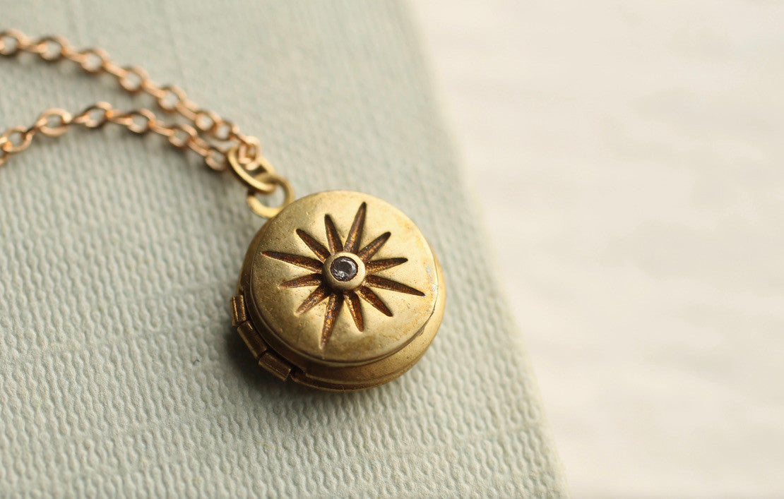 TINY COMPASS STAR LOCKET