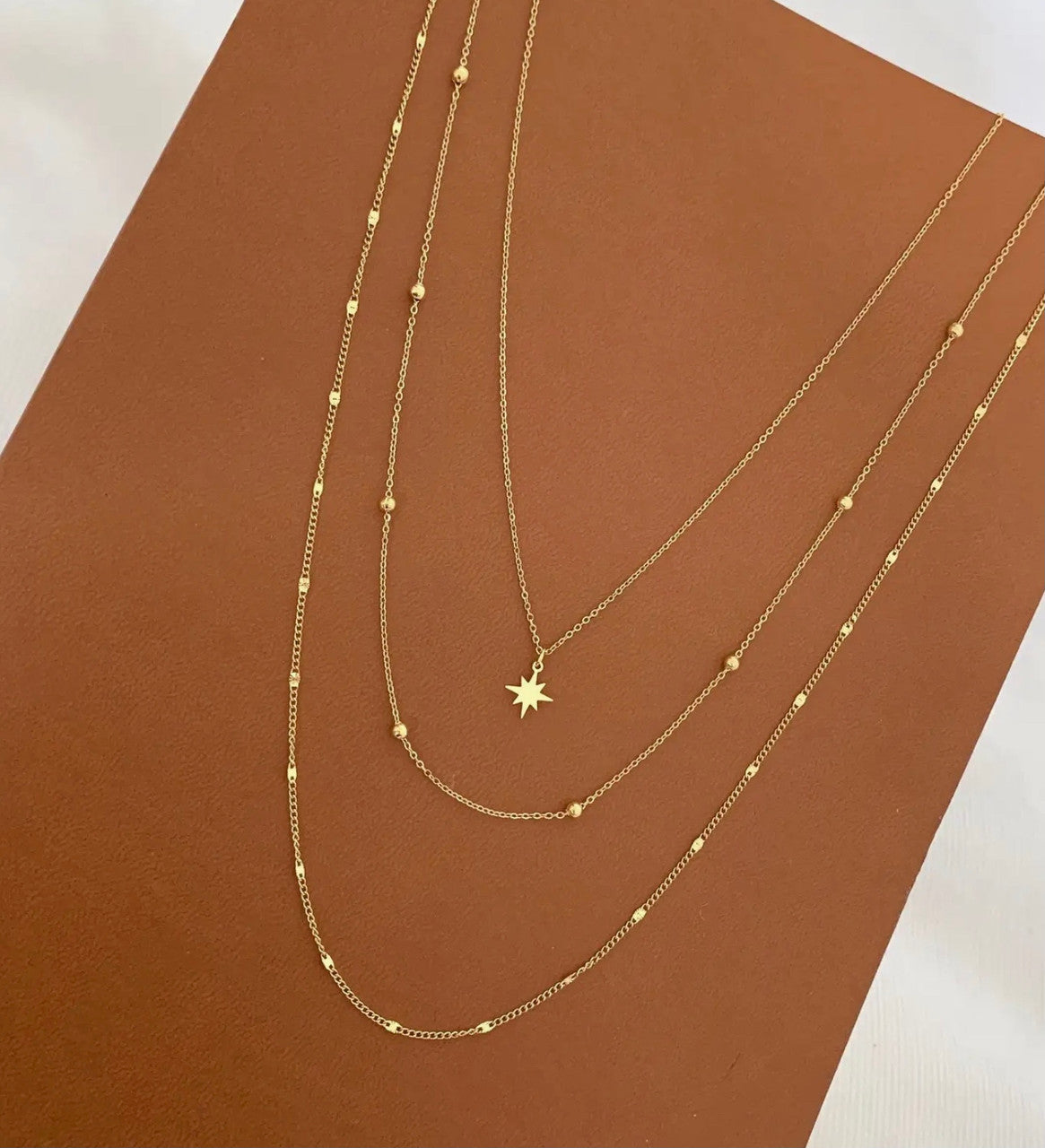 TRIPLE ROW NECKLACE WITH STAR PENDANT