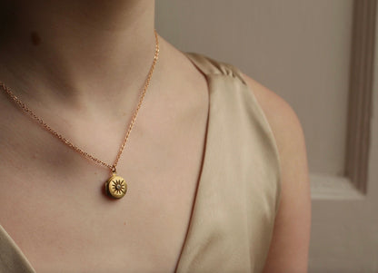 TINY COMPASS STAR LOCKET