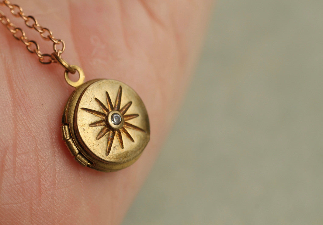 TINY COMPASS STAR LOCKET